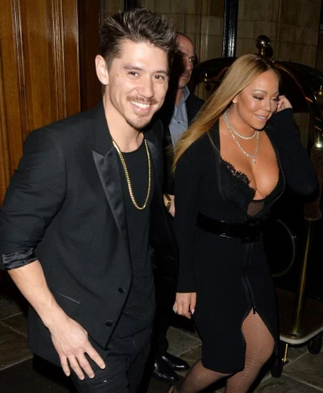 Mariah Carey and Bryan Tanaka hold hands in London | mcarchives.com