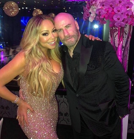 Mariah Carey poses with John Travolta in Austria | mcarchives.com