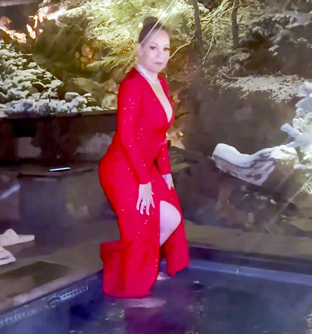 Mariah takes a dip in hot tub while wearing gown | mcarchives.com