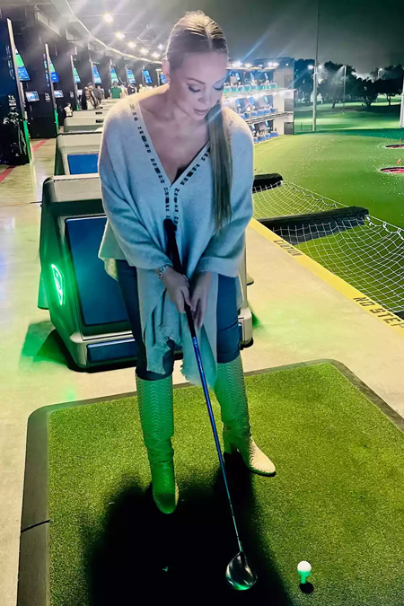 Mariah Carey plays mini golf in knee-high boots | mcarchives.com