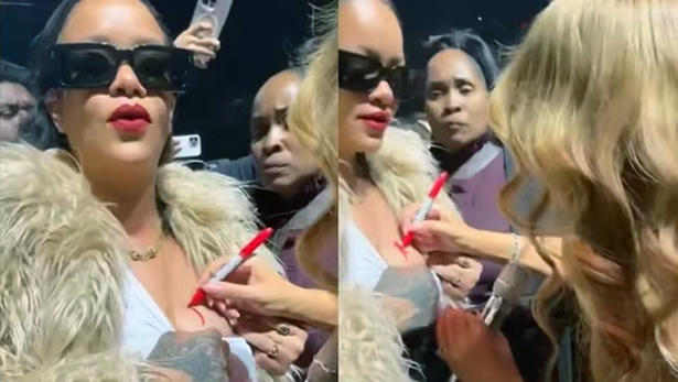 Mariah Carey signs Rihanna's boob  | mcarchives.com