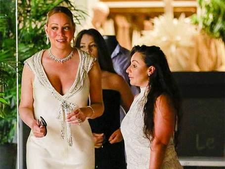 Mariah Carey wears plunging white dress to try on rings | mcarchives.com