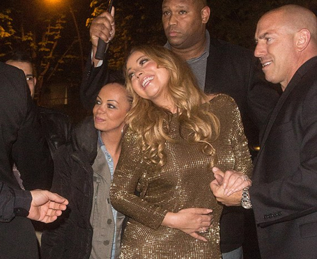 Mariah enjoys Paris night out in glittery gold mini-dress | mcarchives.com